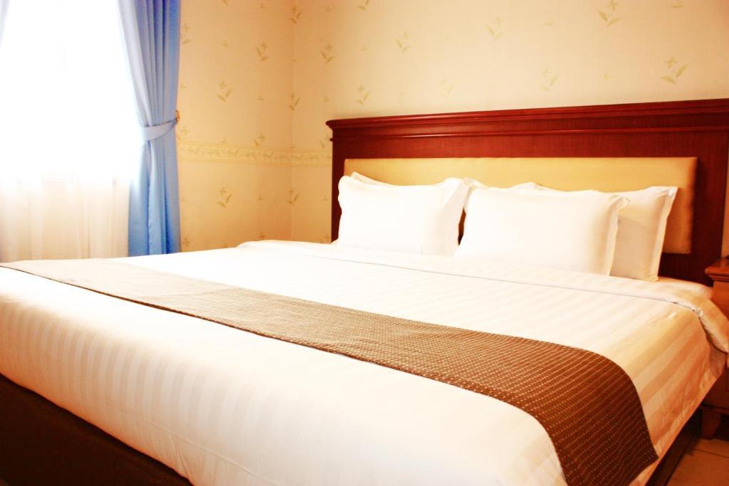 Travellers Suites Apartamentos con servicio Medan Habitación foto