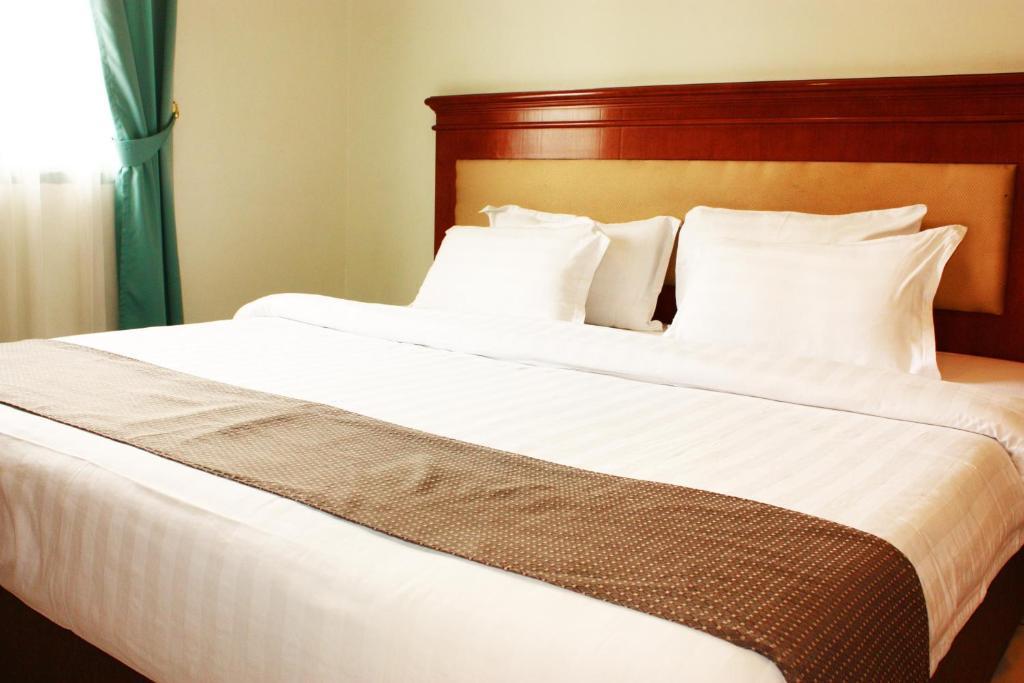Travellers Suites Apartamentos con servicio Medan Habitación foto