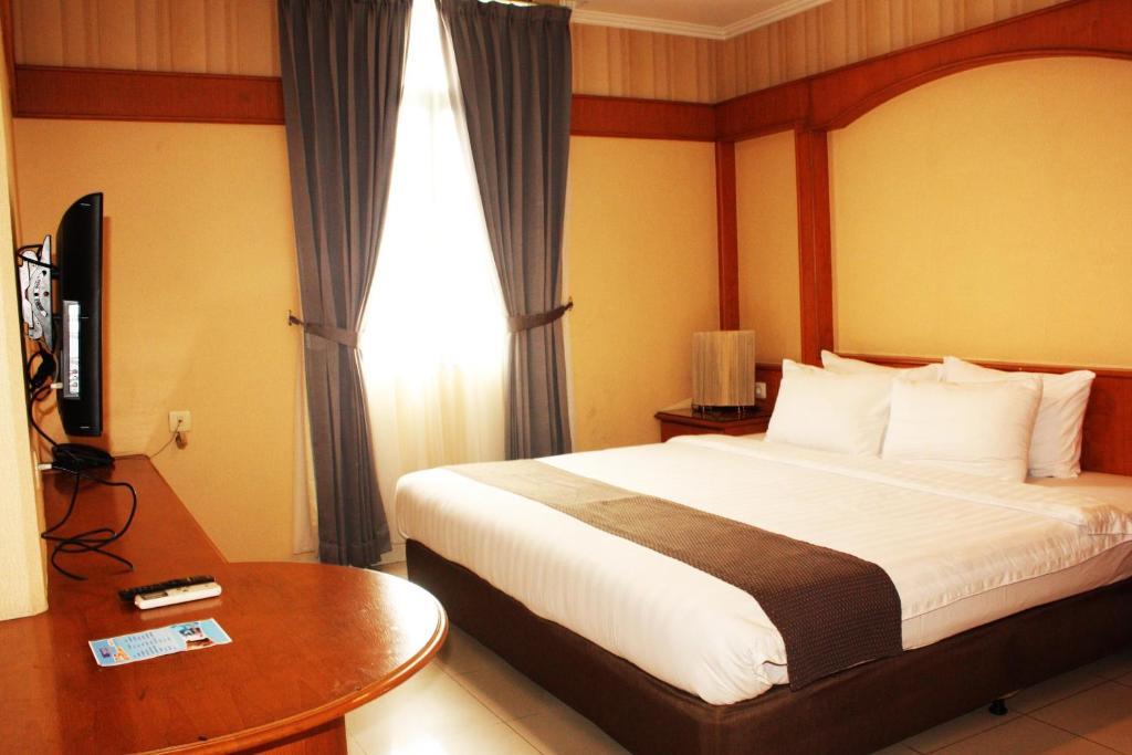 Travellers Suites Apartamentos con servicio Medan Habitación foto